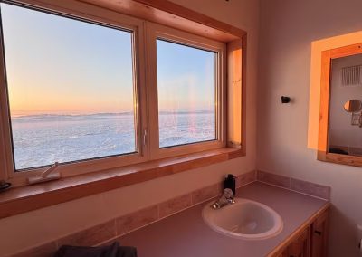Stay by the Sea bedroom 2 spacious private bathroom with stunning view overlooking the frozen Frobisher Bay